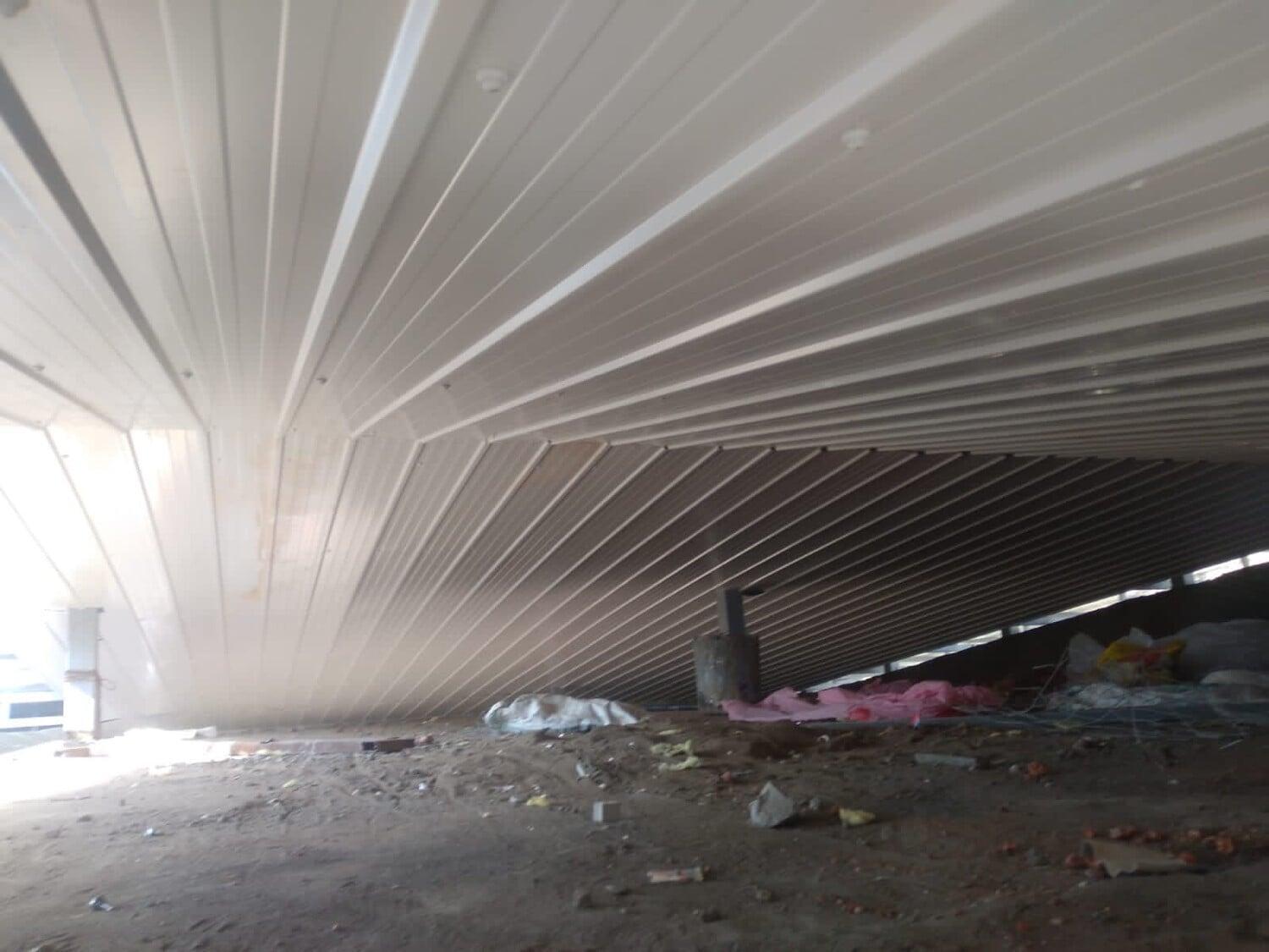 Commercial architectural roofing at Oberoi Mall, Mumbai: Specialized Kliplok roof-on-roof installation by Rishonn & Reyansh for leak-proof retail infrastructure.